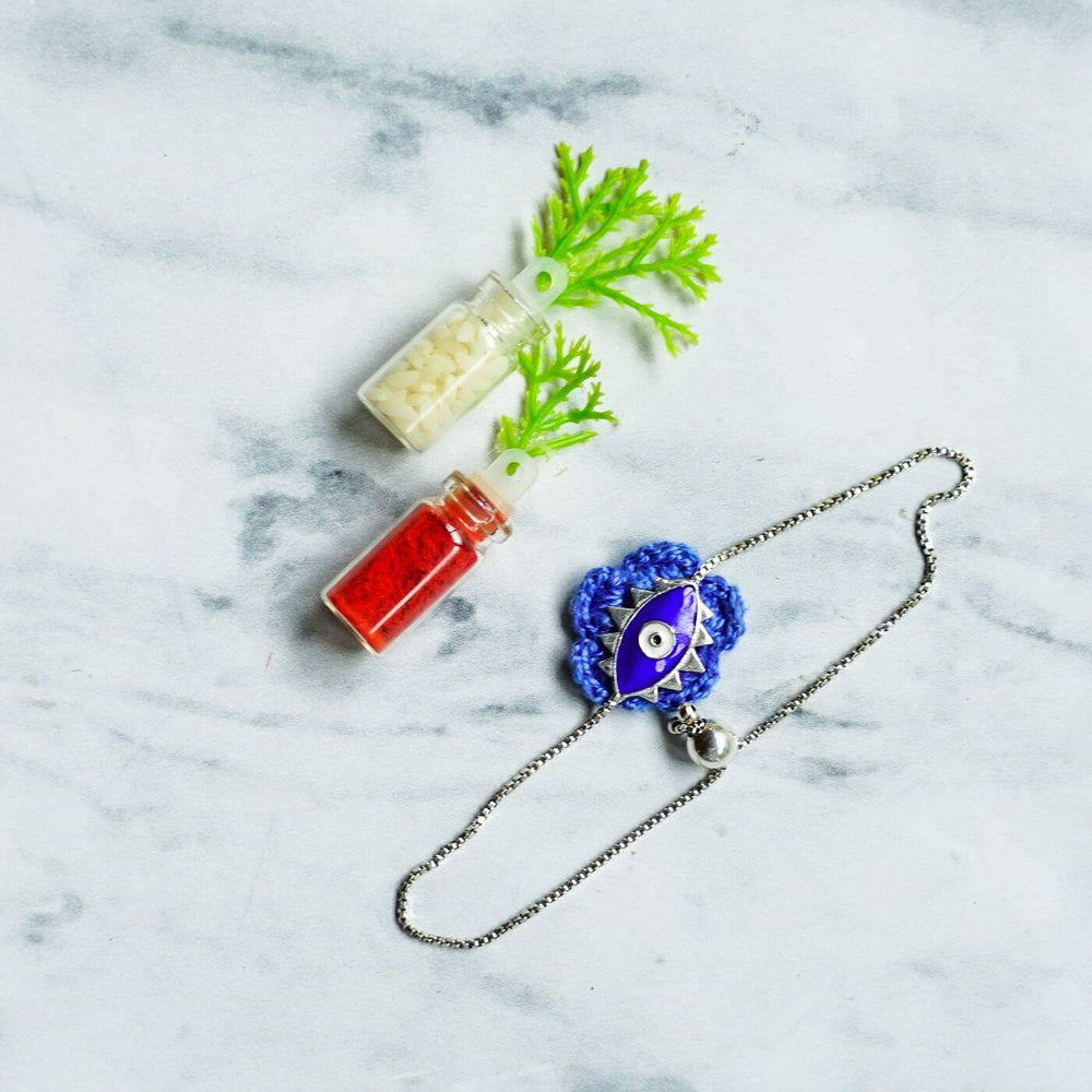 Handcrafted Evil Eye Silver Strap Rakhi For Kids With Rice Roli 1 - Bracelet with Decorative Accessories