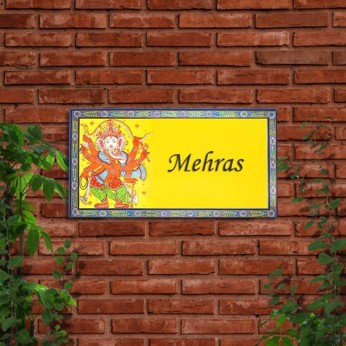 Handpainted Family Pattachitra Board Ganesha - Mounted on Brick Wall Outdoors