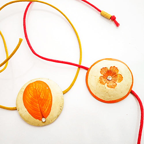 Handcrafted Papier Mache Rakhis Set Of 2 7 - Top View of Two Necklaces