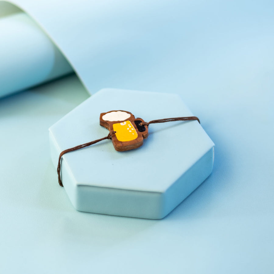 Handpainted Wooden Rakhi Beer - Close-up on Beer Charm Bracelet