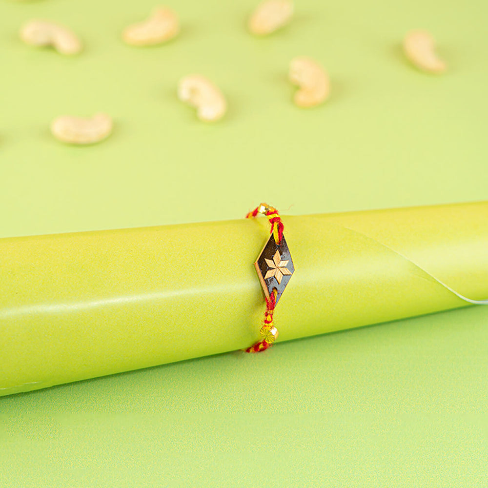 Ecofriendly Bamboo Rakhi With Blue Lamp Motif - Styled on Gift Roll
