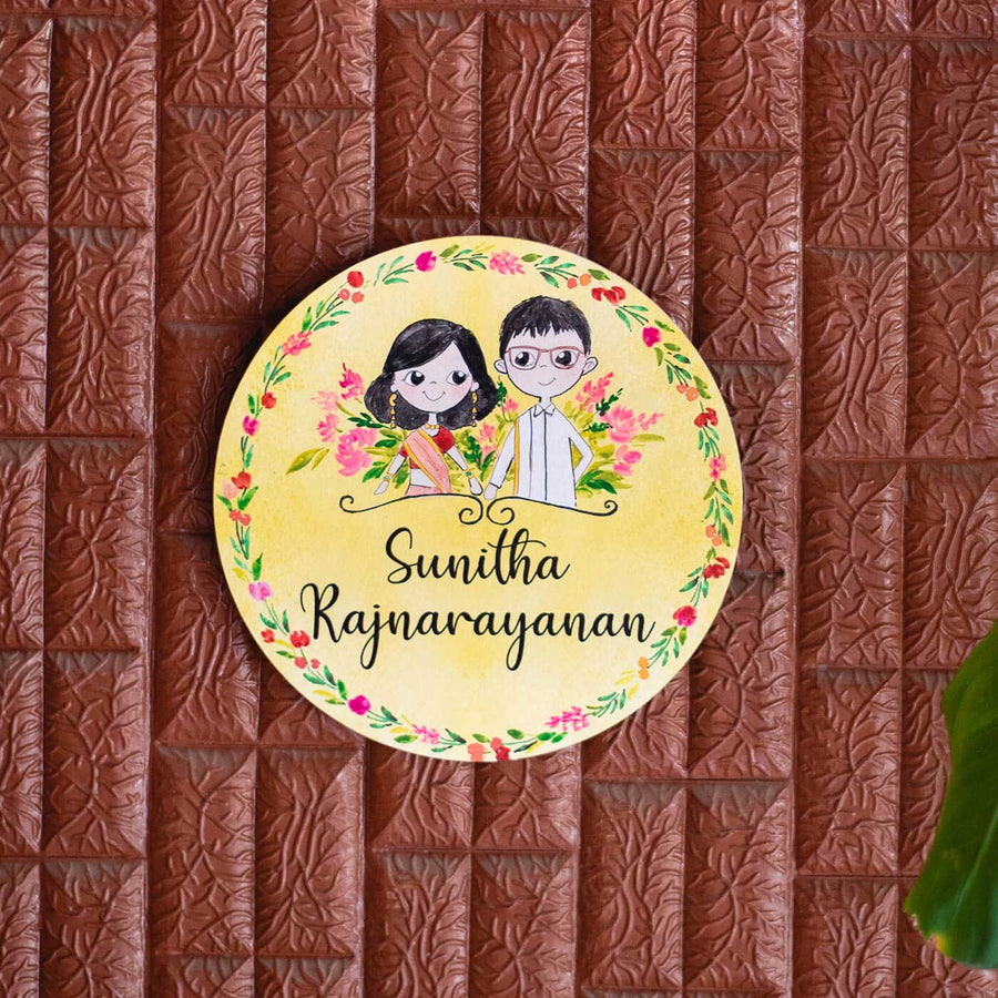 Round Hand Painted Character Name Plate South Indian Couple 2 - Mounted on Textured Wall Background