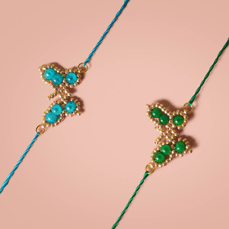 Handcrafted Butterfly Rakhi Set Of 3 - Close-up on beaded bracelets