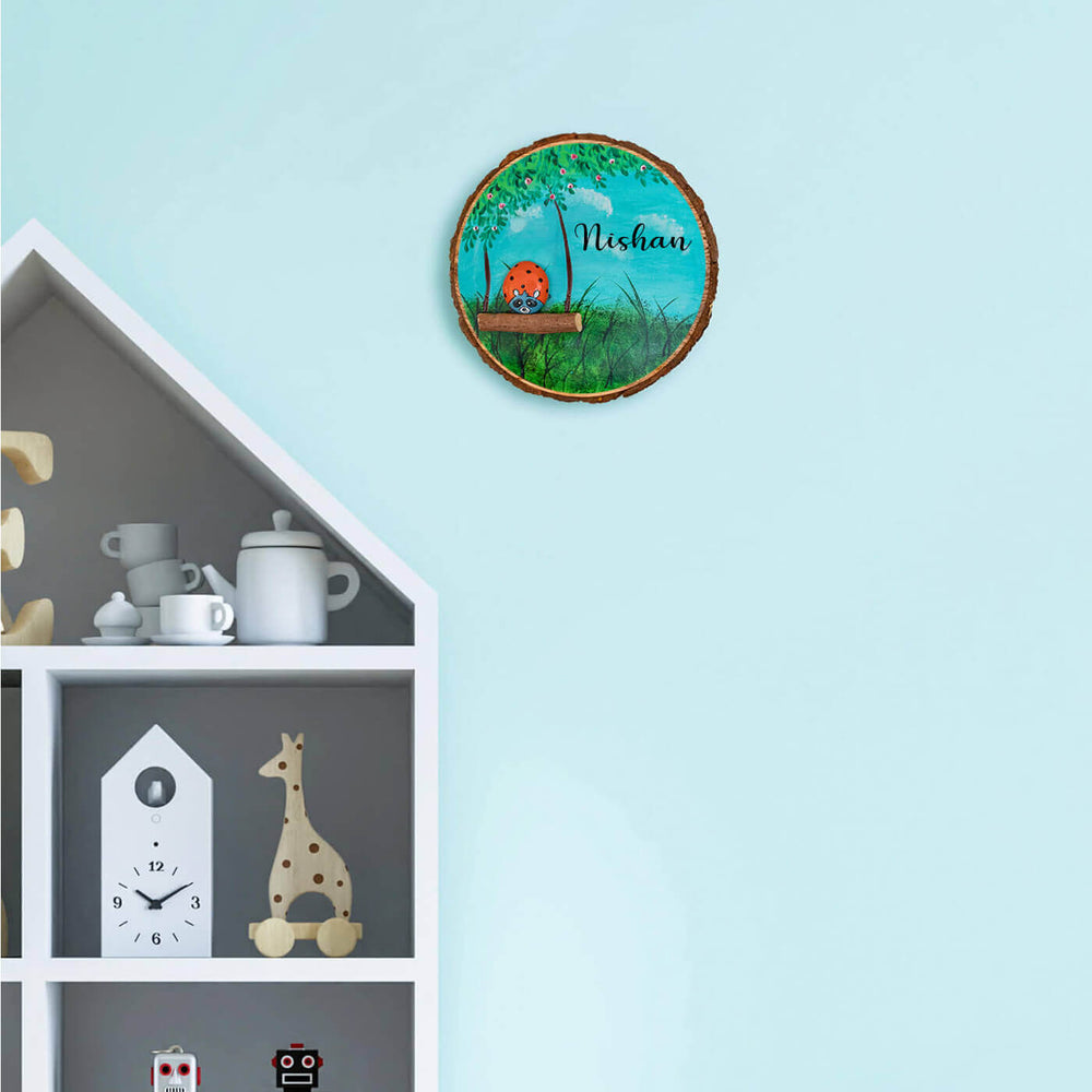 Handpainted Raccoon Pebble Art And Wood Kids Name Plate - Mounted on Wall Above Shelf Display