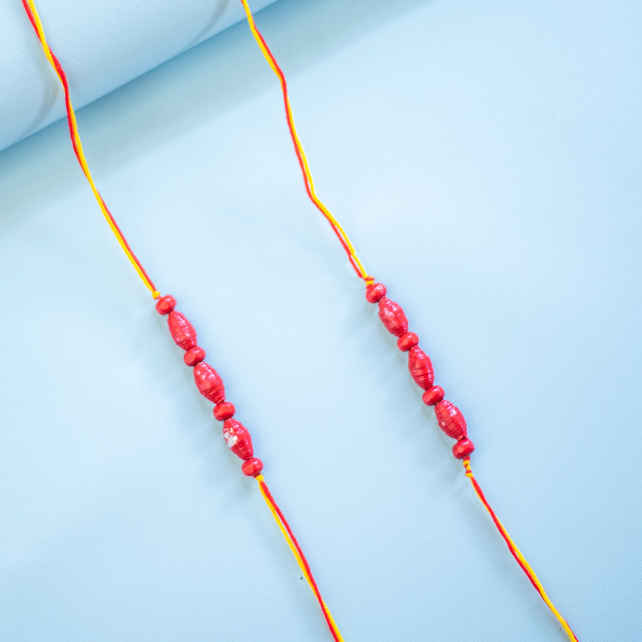 Paper Woven Beaded Rakhi Set With Roli Chawal 1 - Close-up of Pair of Bracelets