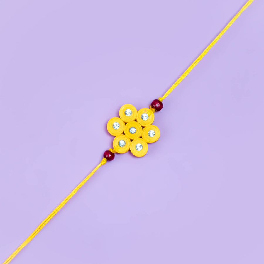 Paper Mache Rakhi Bhaiyya Bhabhi Set Yellow - Close-up View of Rakhi