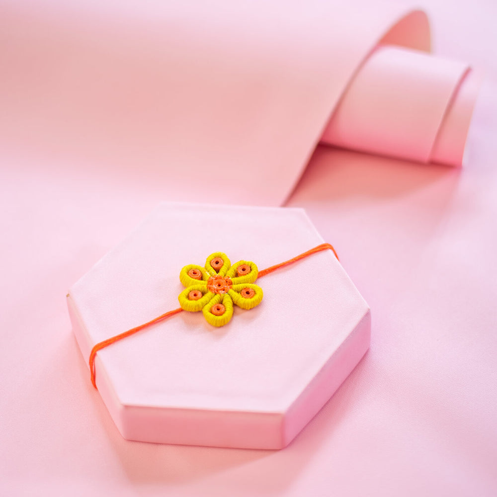 Paper Mache Rakhi Yellow Blossom - Styled on Decorative Hexagon Box