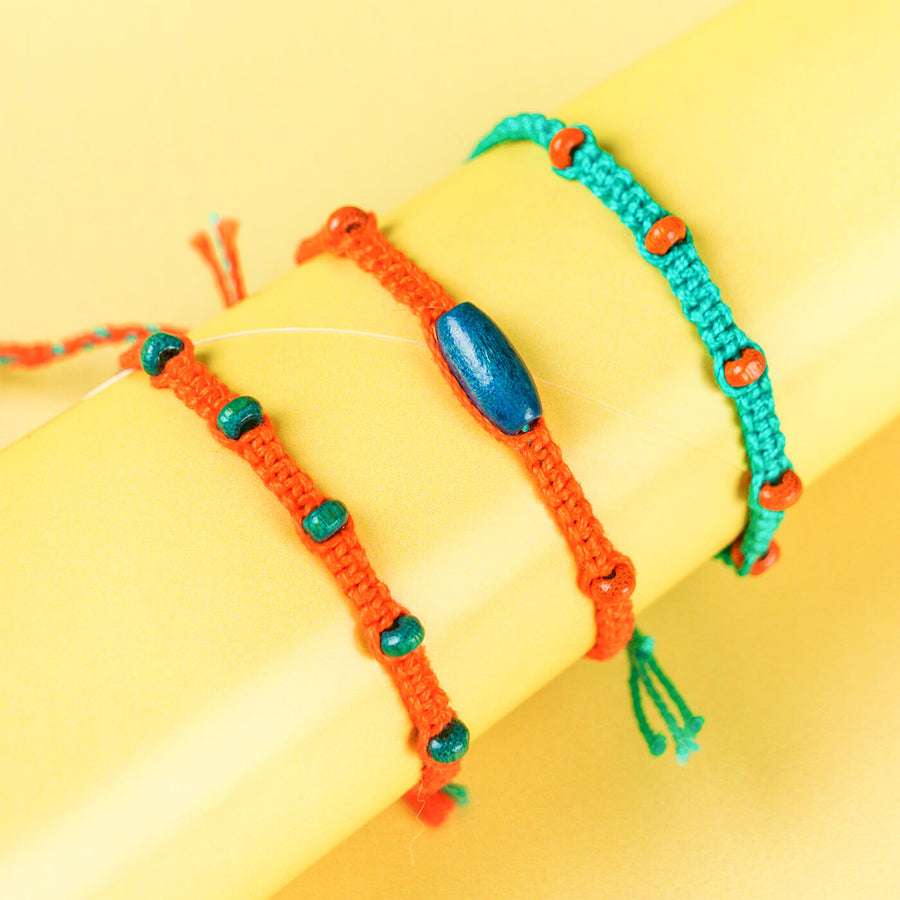 Orange Teal Rakhi With Beads Set Of 4 - Close-up of three bracelets