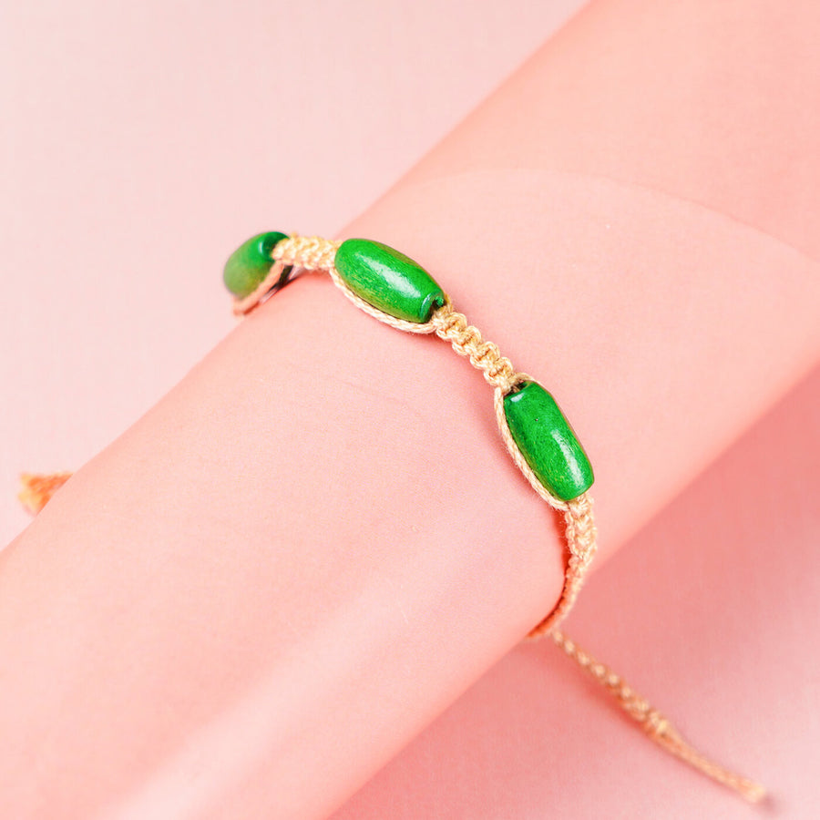 White Macrame Cotton Rakhi With Green Beads - Bracelet Close-up on Wrist