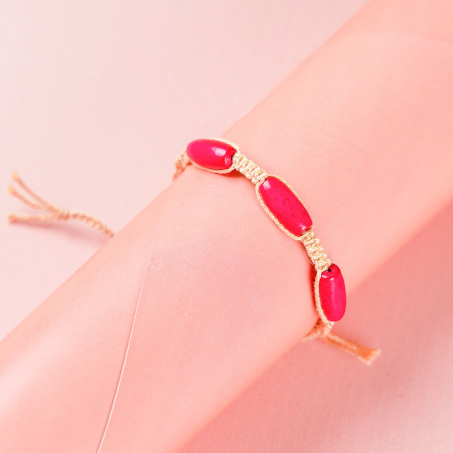 White Macrame Cotton Rakhi With Pink Beads - Wrist Model Display