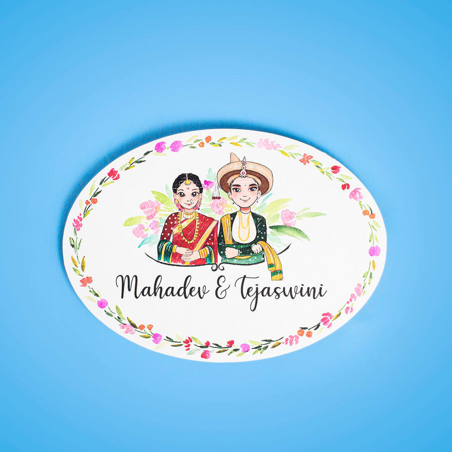 Oval Hand Painted Character Name Plate Marathi Couple - Front View on Blue Background