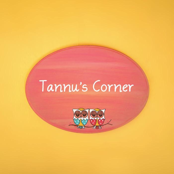 Pink Oval Kid S Name Plate With Madhubani Owl Art - Front View on Wall Background