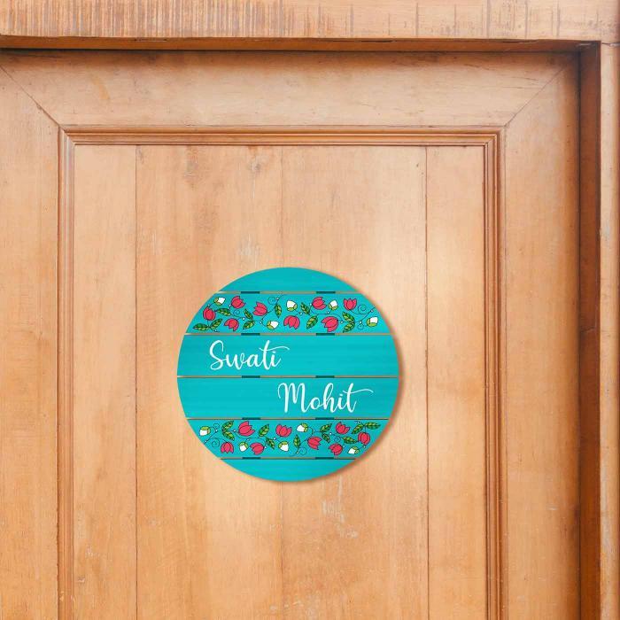 Teal Madhubani Circle Name Plate With Pink Lotus Design - Mounted on Wooden Door Front View