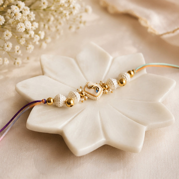 Hand-Knotted White Meenakari Beaded Ghunghroo Rakhi With Roli Chawal For Brother