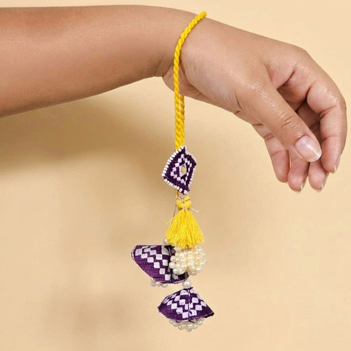 Handcrafted Pearl, Tassel & Thread Work Cheed Light Lumba Rakhi for Bhabhi - Violet