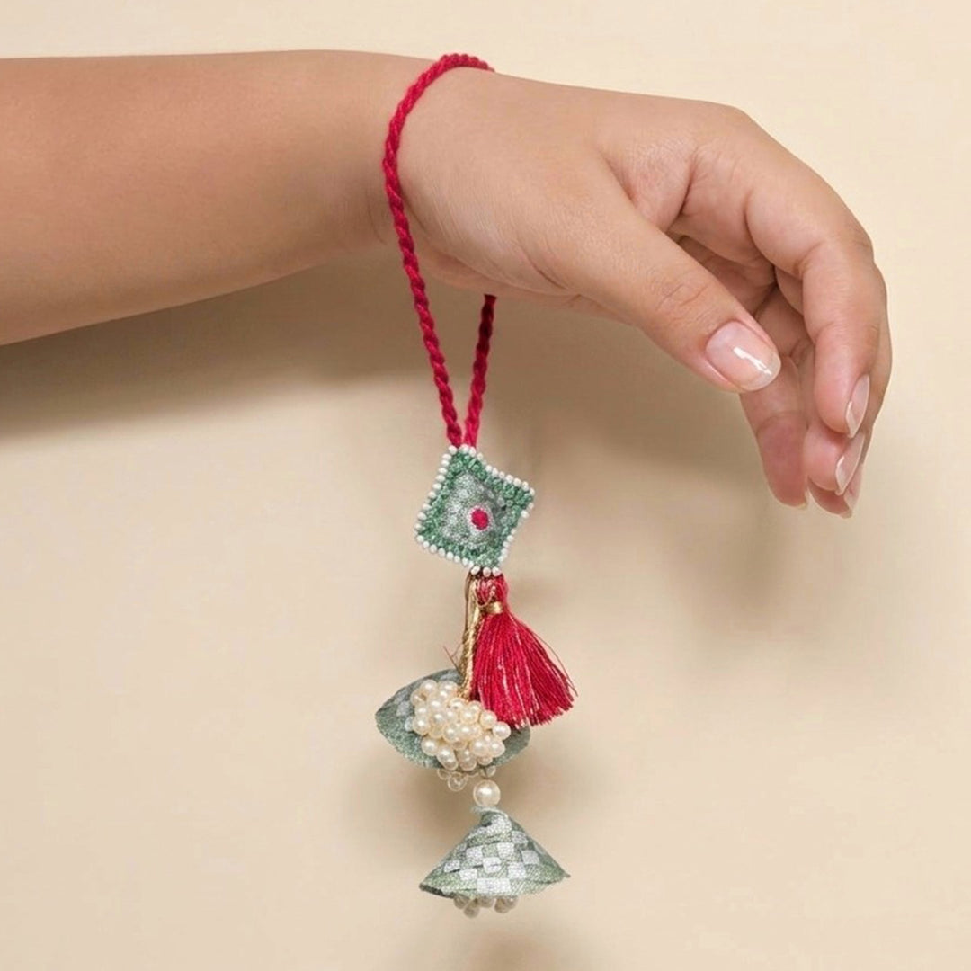 Handcrafted Pearl, Tassel & Thread Work Cheed Light Lumba Rakhi for Bhabhi - Mint Green