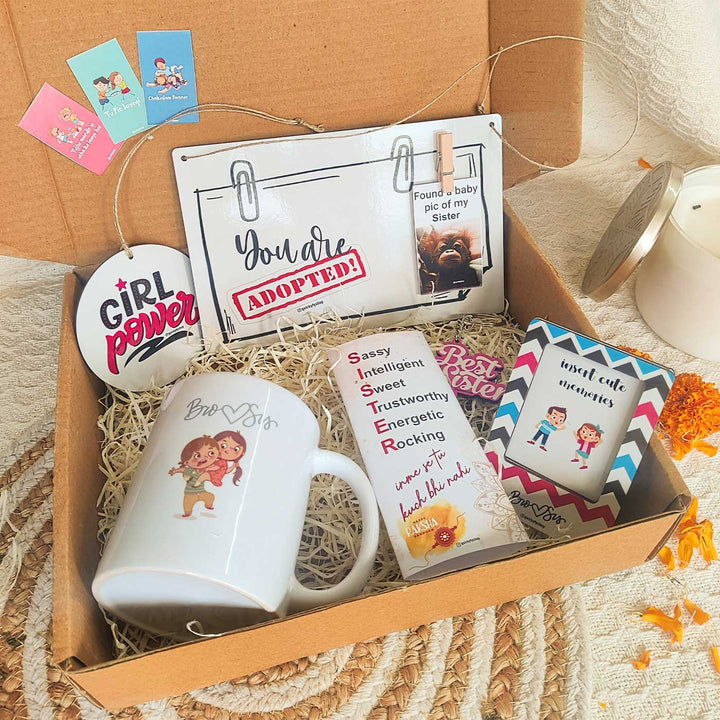 Photo Personalized Girl Power Rakhi Hamper For Sisters | Includes 1 Plaque, 1 Rakhi, 1 Chocolate, 1 Keychain, 1 Car Hanging, 1 Fridge Magnet & 1 Mug