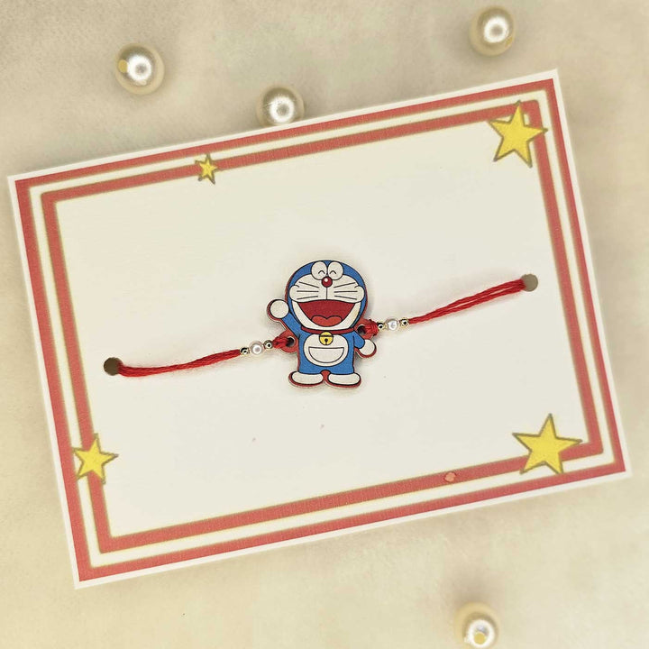 Handmade Doraemon Mdf Wood Kids Rakhi With Roli Chawal - Displayed on Gift Card
