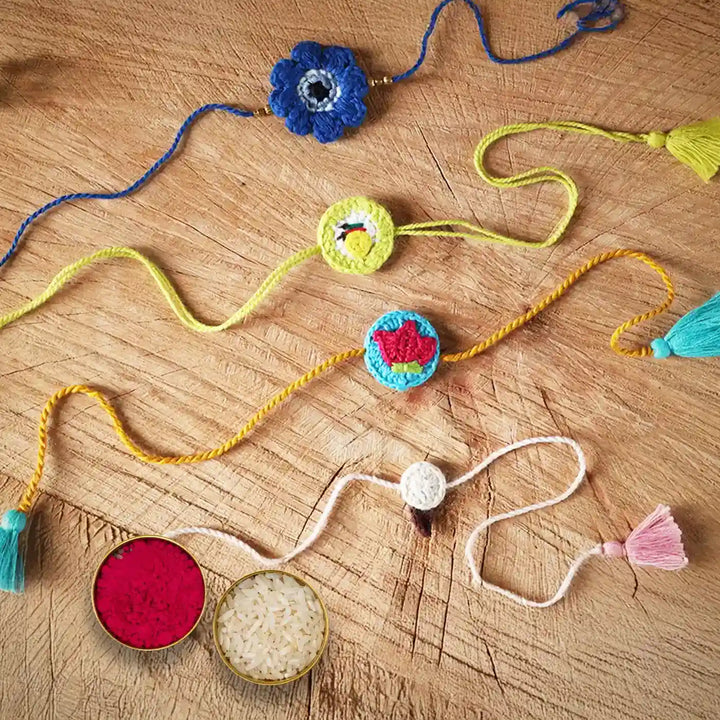 Handmade Crochet Evil Eye Lemon Strawberry Ice Cream Rakhi With Roli Chawal Set Of 4 - Flat Lay Showing Bracelet Details