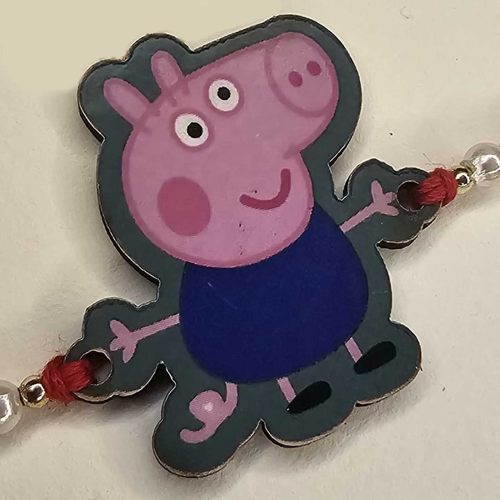 Handmade Peppa Pig Mdf Wood Kids Rakhi With Roli Chawal - Close-up Side View of Boy Character