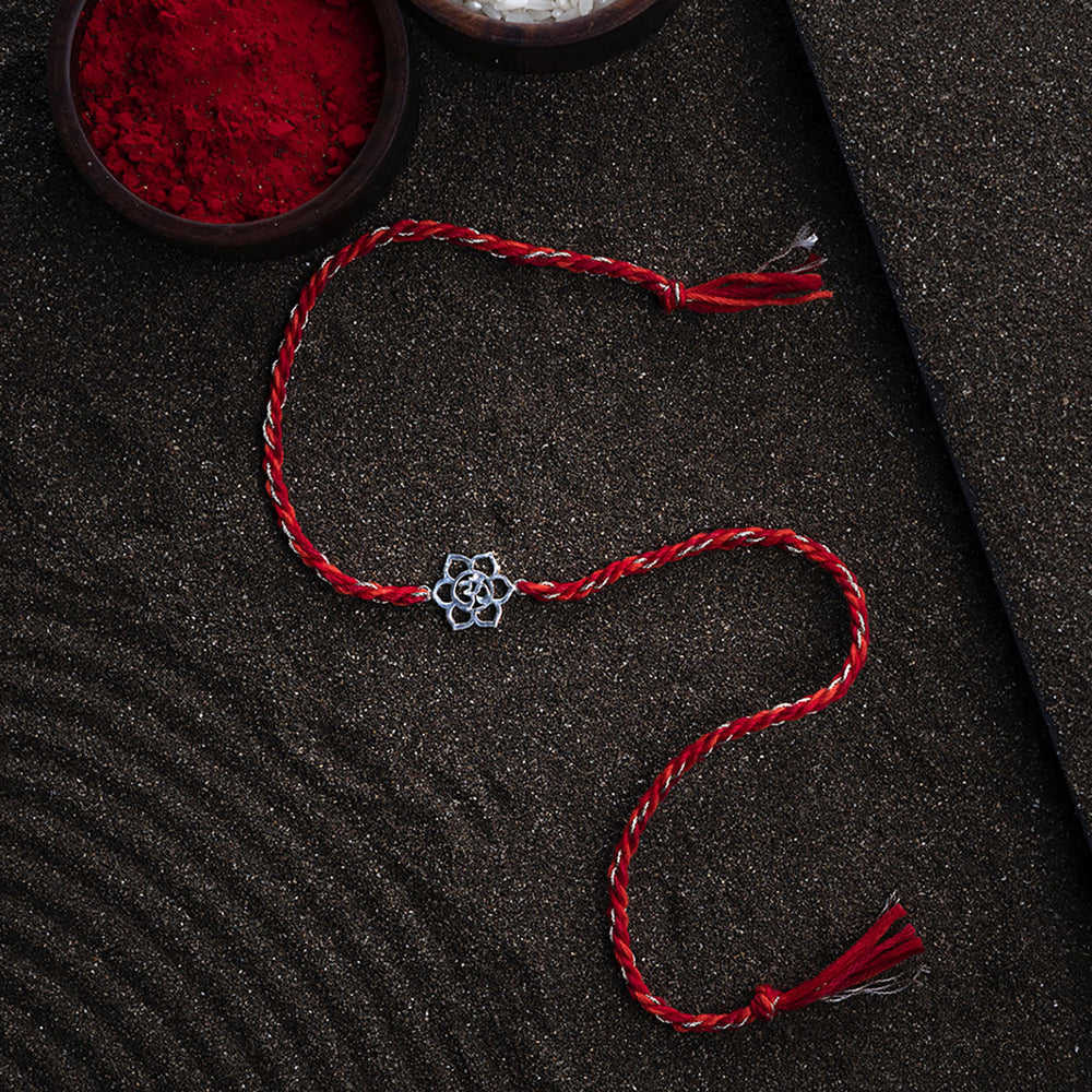 Handmade Rudra 925 Silver Rakhi With Roli Chawal For Brother - Flat Lay with Decorative Background