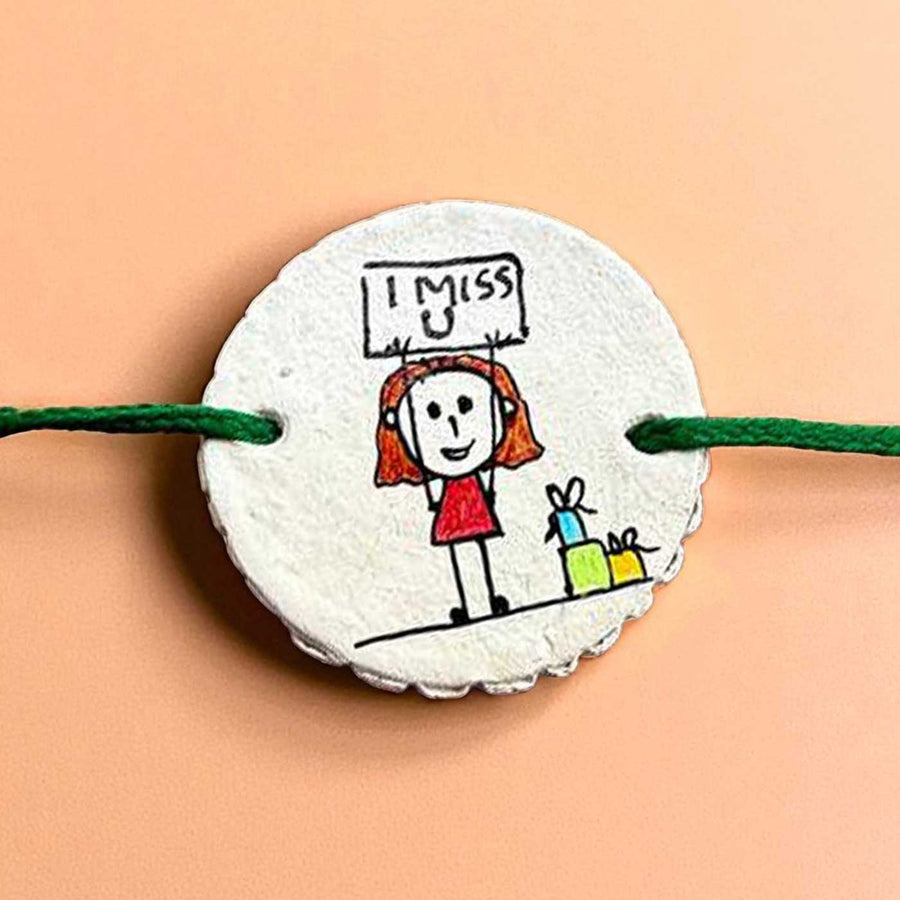 Personalized Hand Painted Miss You Theme Clay Rakhi With Roli Chawal - Close-up of Bracelet Detail