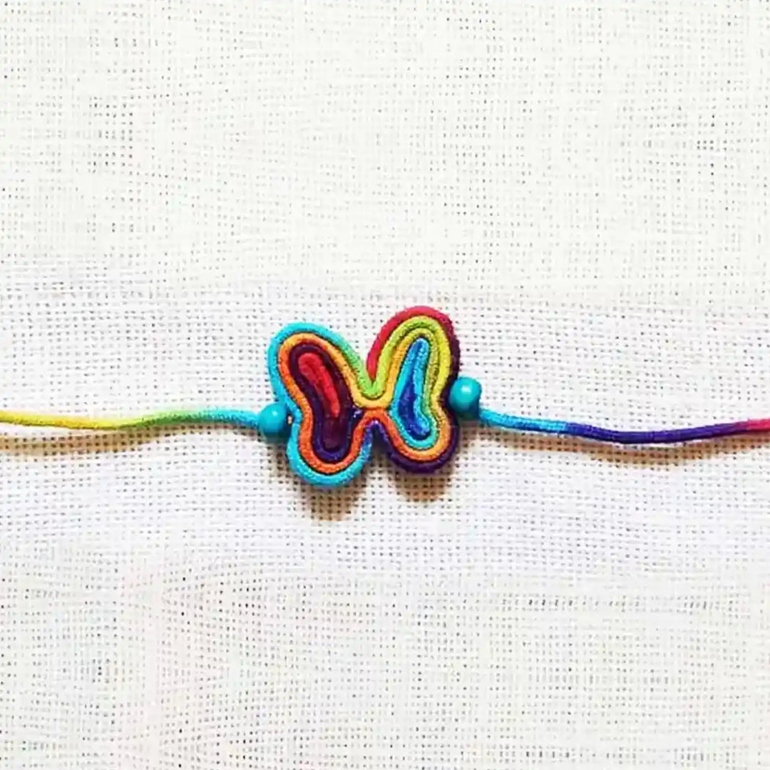 Handmade Dori Work Butterfly Kids Rakhi With Roli Chawal - Close-up Front View
