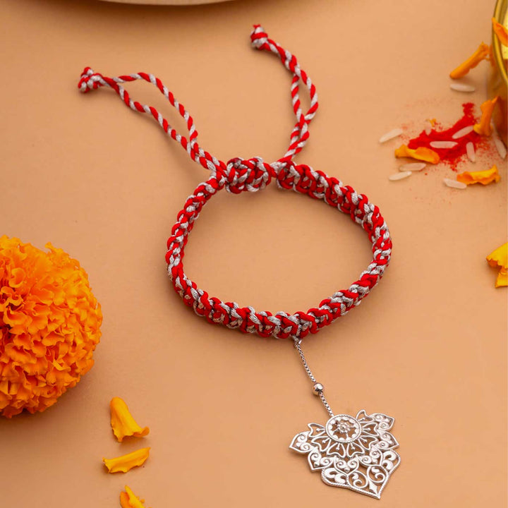 Handmade Ornate Filigree Design Silver Lumba Rakhi For Bhabhi - Close-up Front View of Rakhi