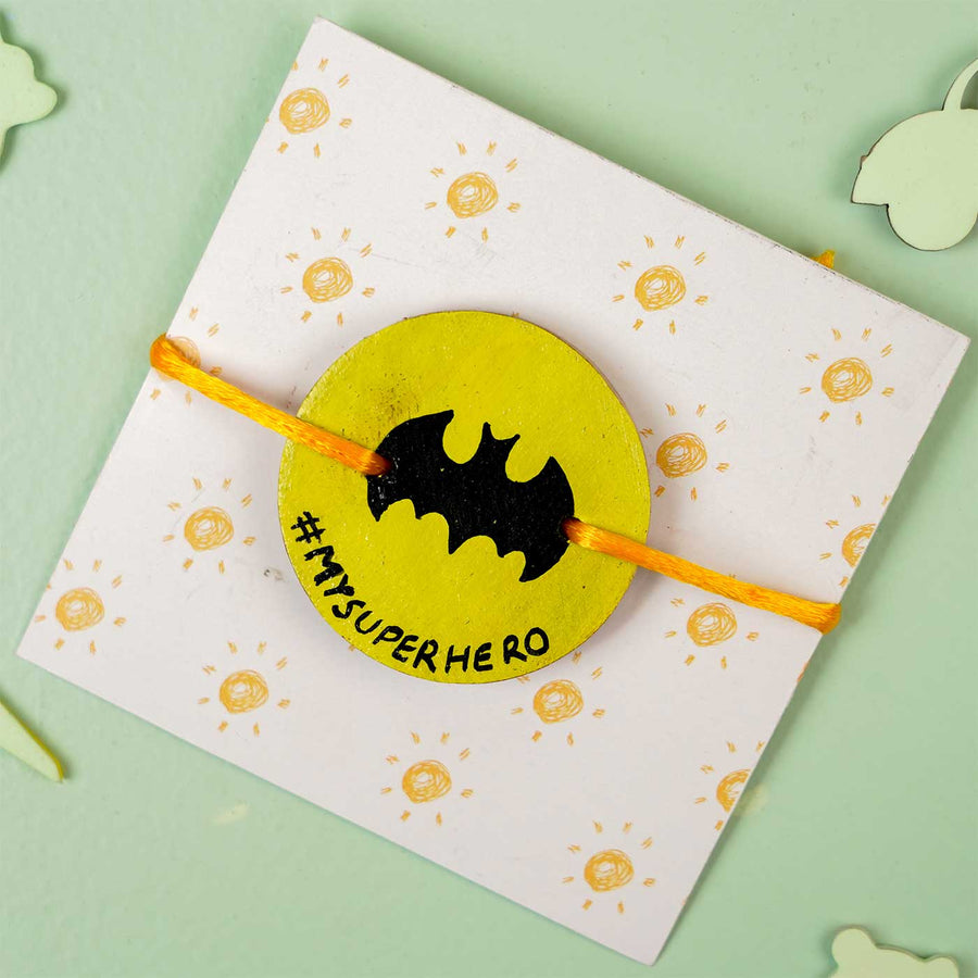 Personalized Hand Painted Batman Wooden Rakhi With Roli Chawal - Front View on Decorative Card