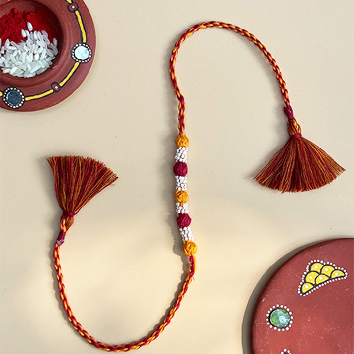 Handmade Reusable Maroon And Yellow Beaded Patwa Rakhi For Brother