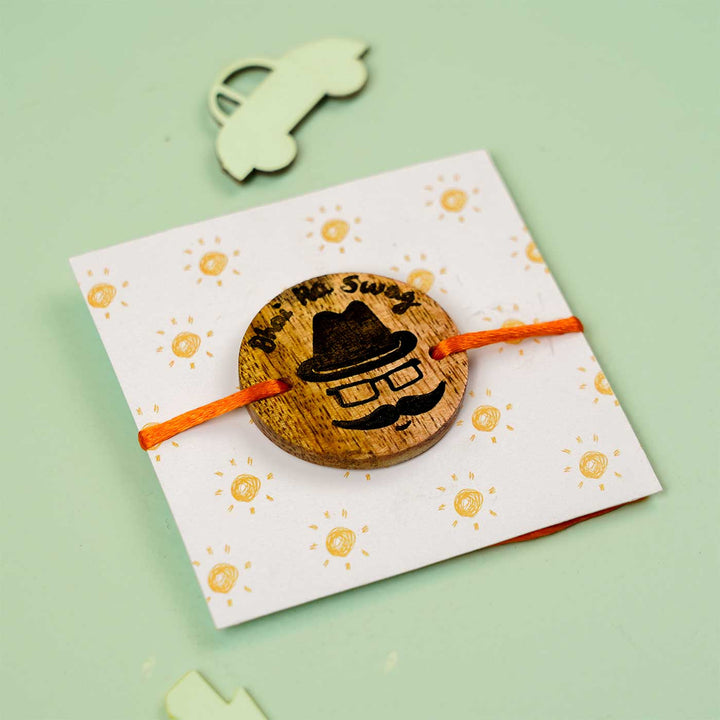 Personalized Hand Painted Bhai Swag Wooden Rakhi With Roli Chawal - Angled View on Card Display