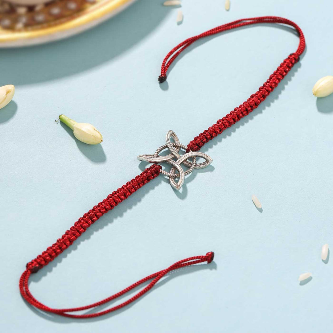 Handmade Witches Knot Design Silver Rakhi For Brother - Full bracelet laid flat