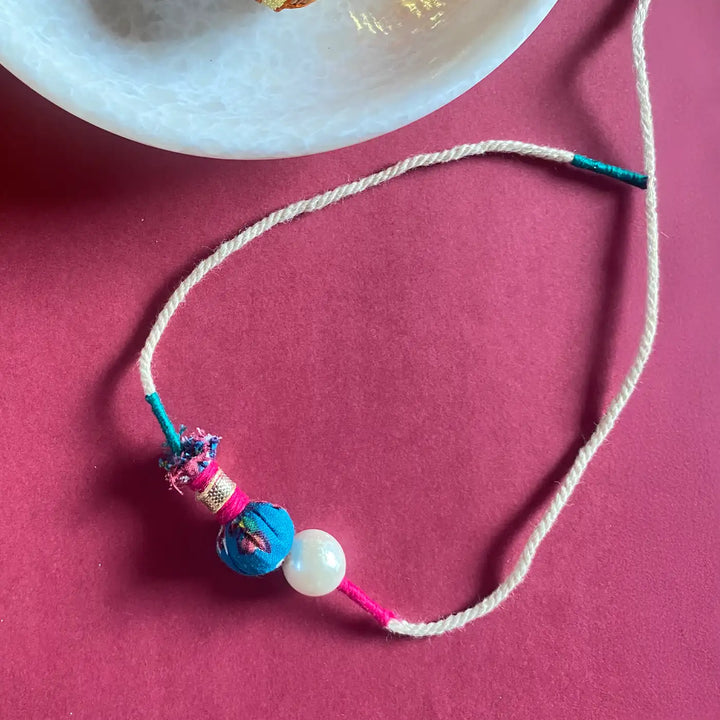 Handmade Ecofriendly Jhoomar Pearl Rakhi With Roli Chawal