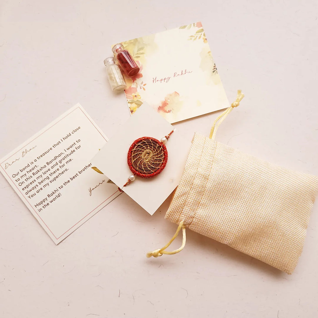 Eco Friendly Handmade Gold And Red Pine Needle Rakhi With Pouch And Roli Chawal - Packaging and Card Included