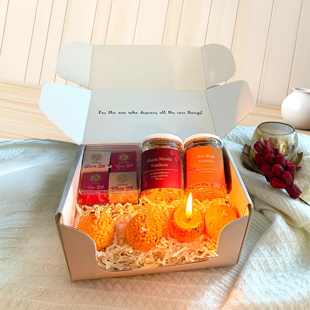 Festival Glow Diwali Gift Hamper | Includes 4 Choco Bites, 2 Namkeen Jars, 4 Laddoo Candles, 1 Gift Box