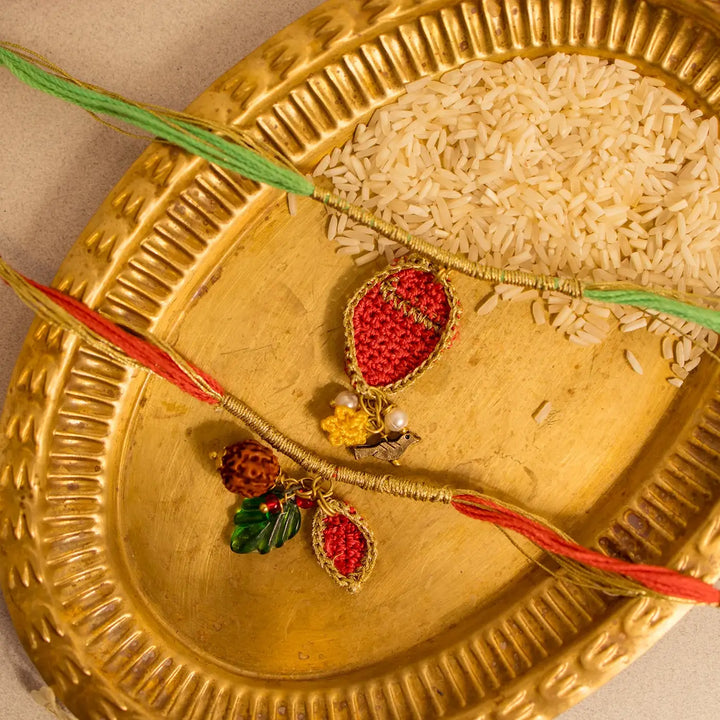 Handmade Crochet Ananya Paati Rakhi With Roli Chawal Set Of 2 - Close-up of Twin Rakhi Threads