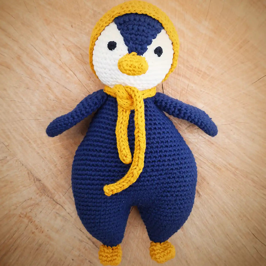 Handmade Crochet Penguin Theme Kids Rakhi And Toy Combo With Roli Chawal Set Of 2 - Front View of Main Doll