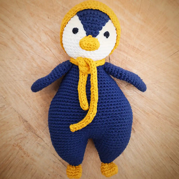 Handmade Crochet Penguin Theme Kids Rakhi And Toy Combo With Roli Chawal Set Of 2 - Front View of Main Doll