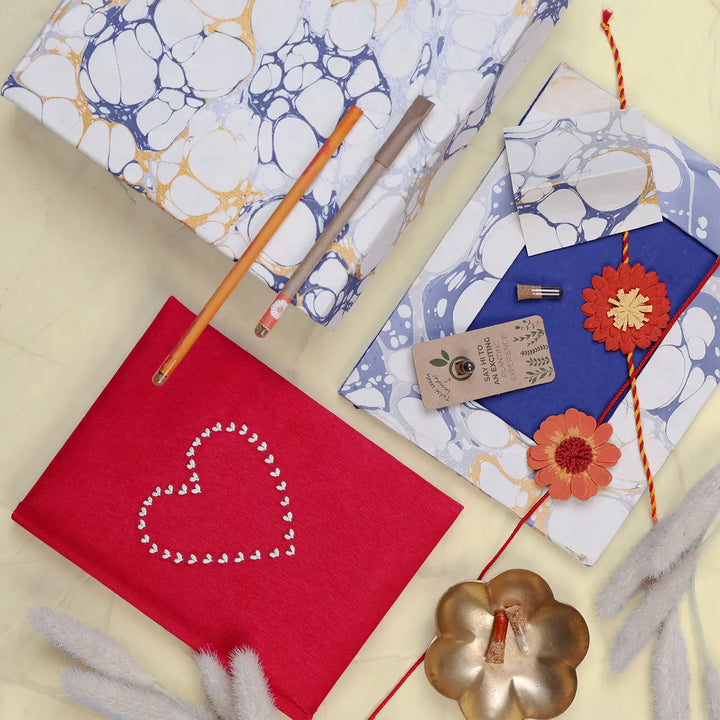 Eco-Friendly Festive Rakhi Hamper | Includes 1 Notebook, 1 Photo Frame, 1 Plantable Pen, 1 Plantable Pencil, 2 Rakhis, 1 Roli Chawal & 1 Greeting Card