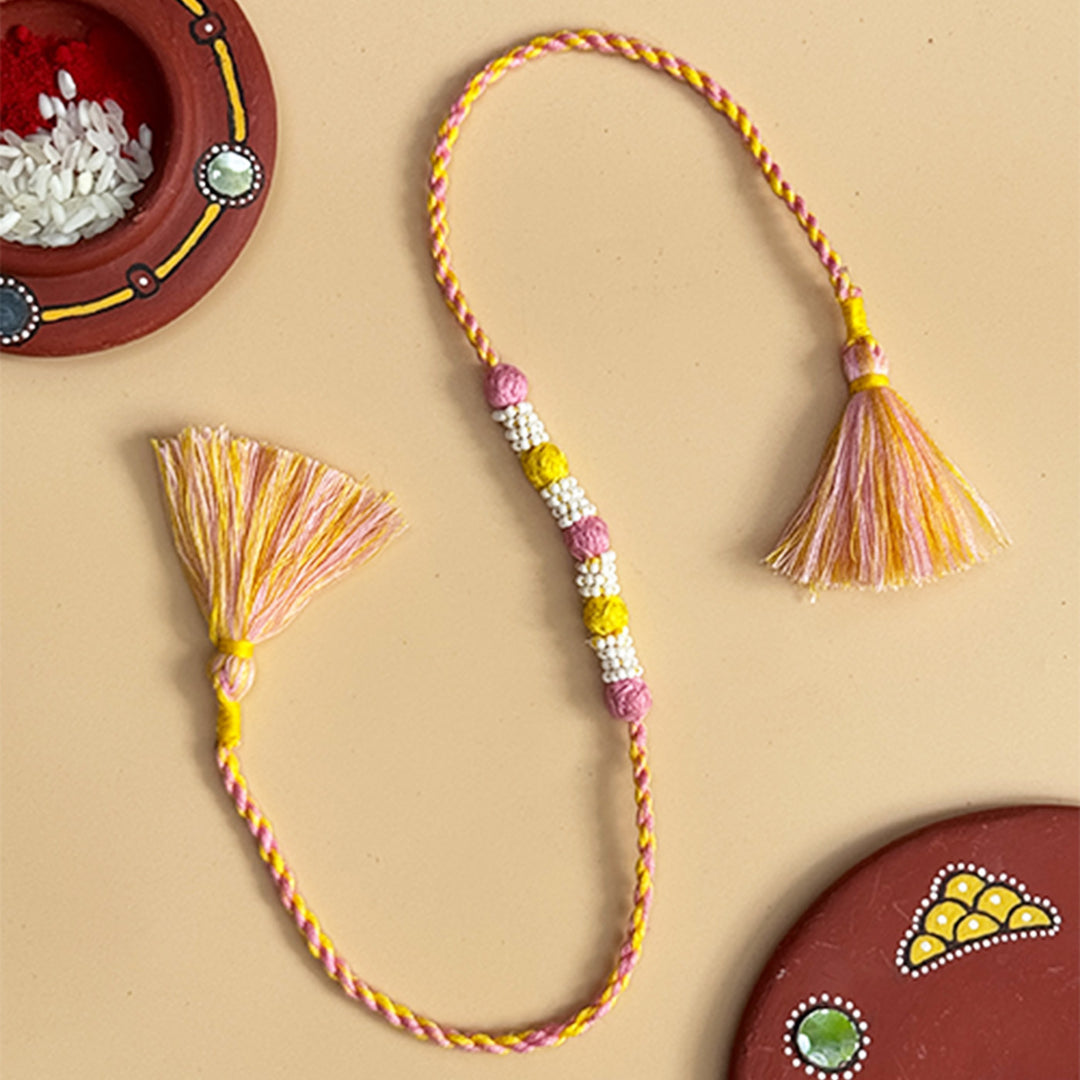 Handmade Reusable Light Pink And Yellow Beaded Patwa Rakhi For Brother