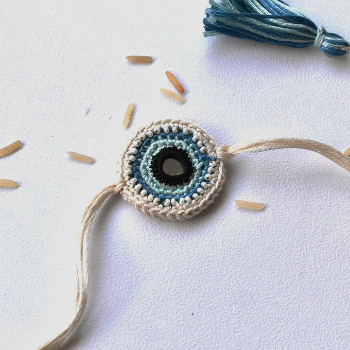 Handmade Crochet Blue Evil Eye Rakhi With Roli Chawal