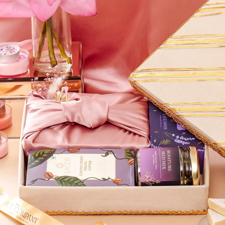 Festive Limelight in Lilac Gift Hamper | Includes 1 Kaju Katli Box, 1 Lavender Dhoop Cones Box, 1 Smoor Rice Crisps, 1 Signature Seed Mix, 1 Gift Box