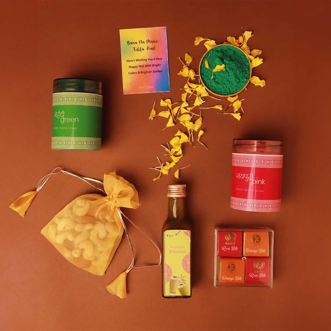 Blissful Holi Gift Box | Includes 2 Organic Color Jars, 1 Mix Nuts Potli, 4 Rose & Orange Bites in Acrylic Box, 1 Thandai, 1 Faux Marigold Flower, 1 Holi Card, 1 Corrugated Gift Box