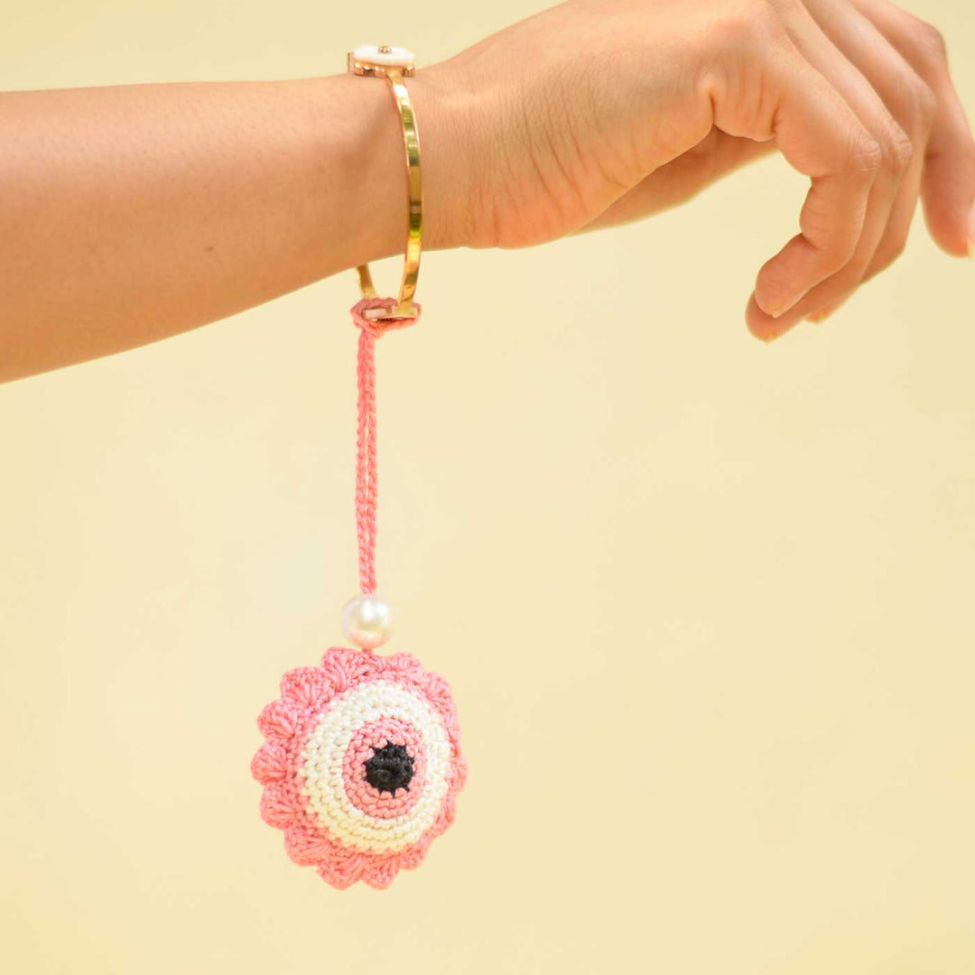 Handmade Crochet Evil Eye Design Cotton Lumba Rakhi For Bhabhi - Wrist Display Example