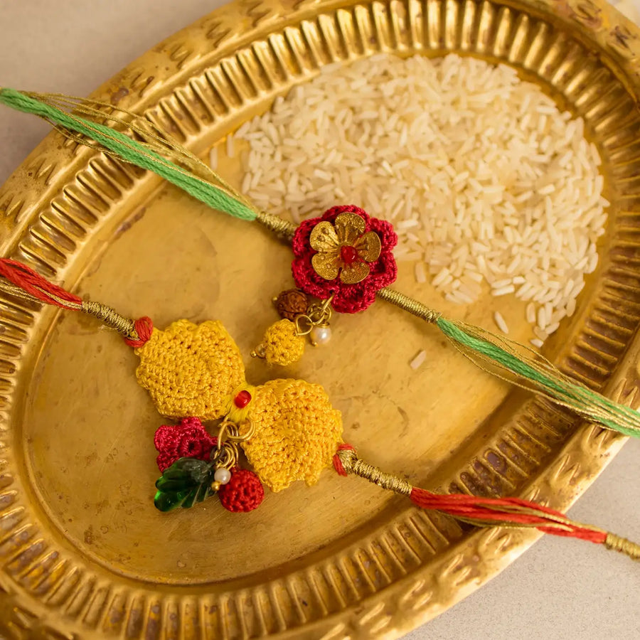 Handmade Crochet Ananya Golden Flower Rakhi With Roli Chawal Set Of 2 - Close-up Detail View