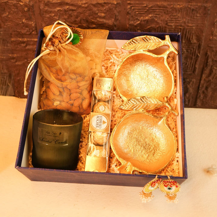 Anar Aura Diwali Gift Hamper | Includes 2 Dry Fruit Potlis, 2 Hangings, 1 Candle, 1 Ferrero Rocher Box, 2 Pomegranate Platters, 1 Diwali Card, 1 Gift Box