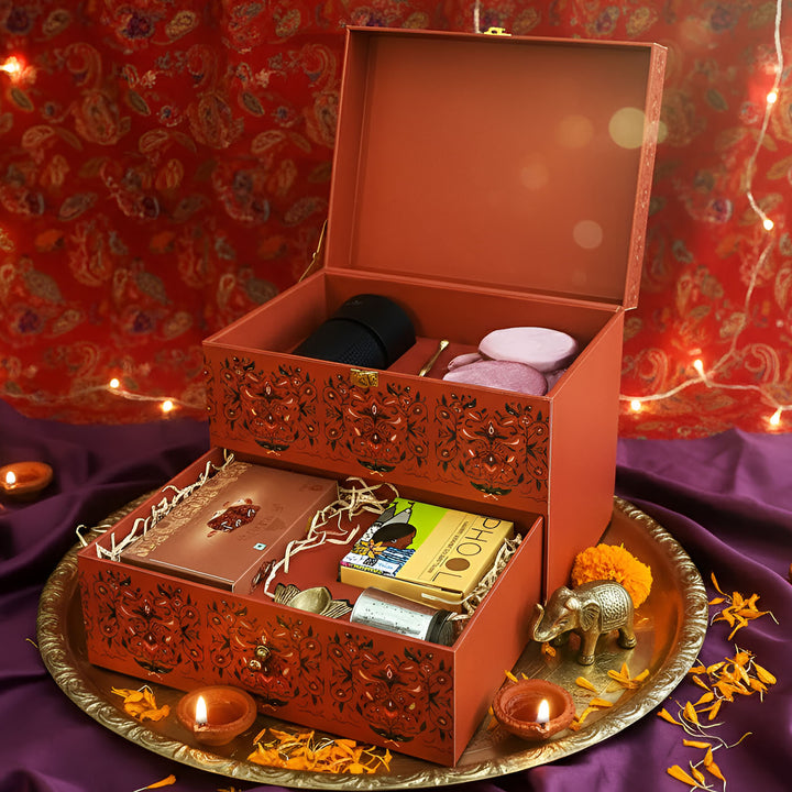 The Heritage Bloom Premium Diwali Gift Hamper | Includes 1 Brass Diya, 1 Air Purifier, 1 Prayer Bell, 2 Dry Fruit Jars, 1 Doda Barfi, 1 Incense Cones Pack, 1 Candle Holder, 1 Gift Box