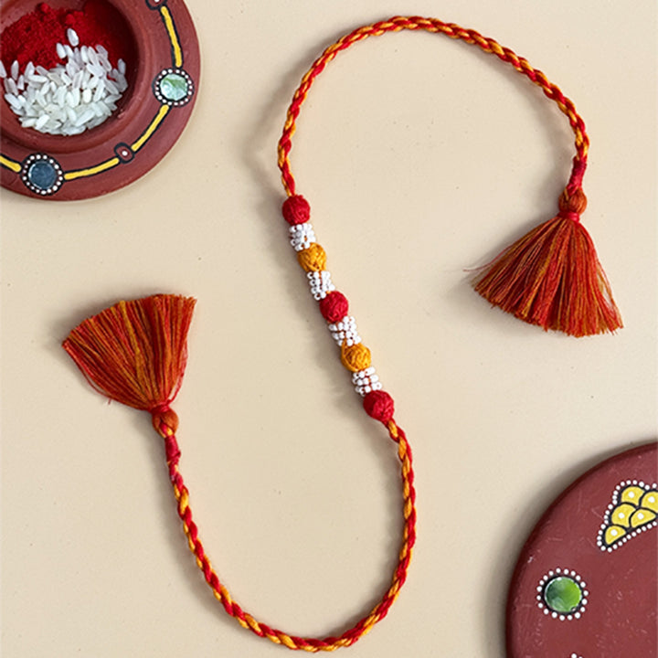 Handmade Reusable Red And Yellow Beaded Patwa Rakhi For Brother