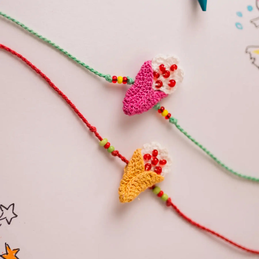Handmade Crochet Beaded Ice Cream Theme Kids Rakhi With Roli Chawal Set Of 2 - Close-up of Crochet Flower Charms