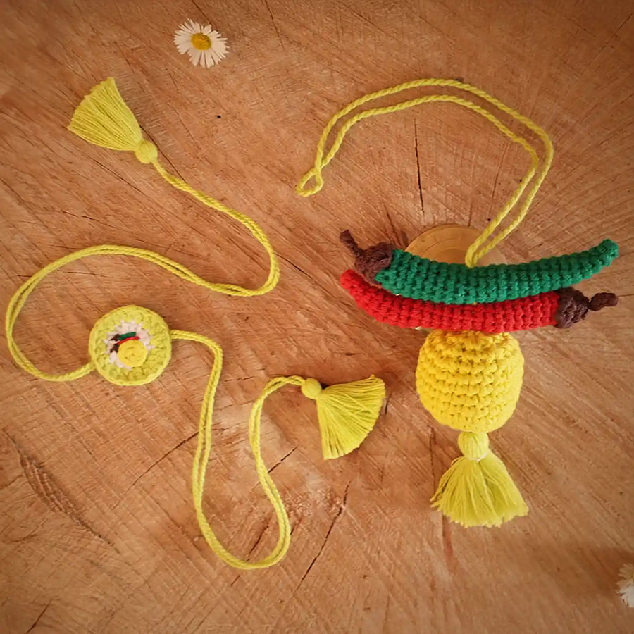 Handmade Crochet Nimbumirchi Rakhi And Hanging Combo With Roli Chawal Set Of 2 - Flat Lay Display
